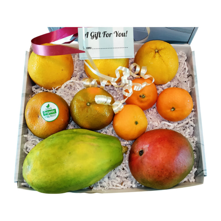 Organic fruit gift box with oranges and tropical fruits