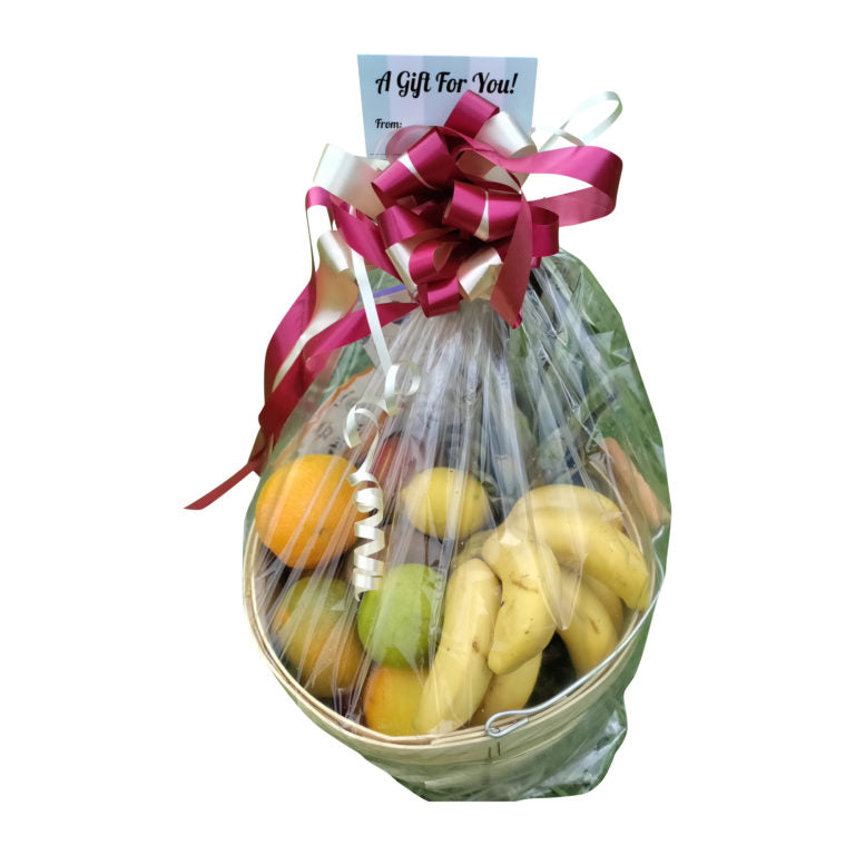 Assorted organic tropical fruits in a gift basket